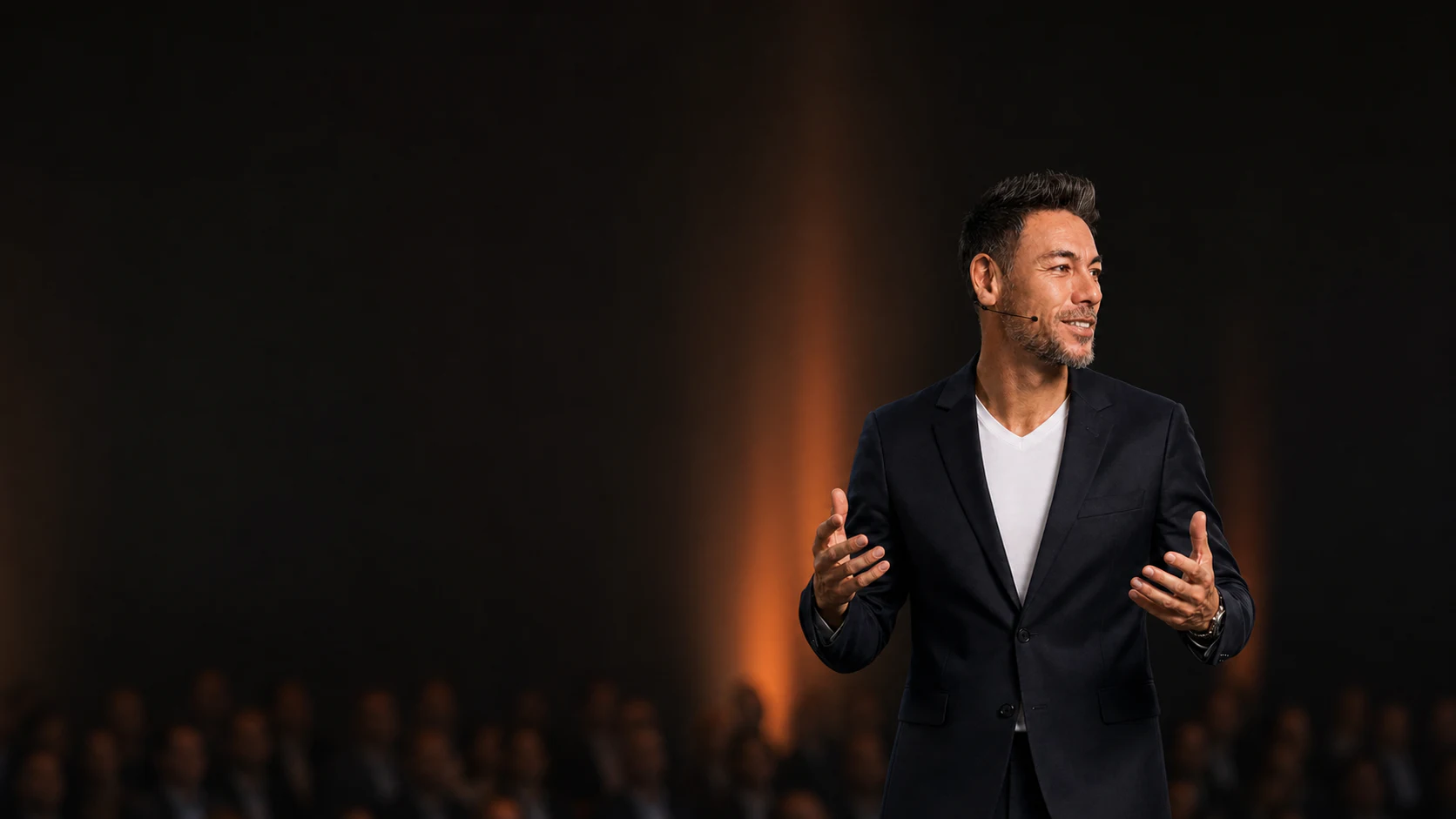 Generated stage portrait of Elton Lau speaking to an indistinct audience